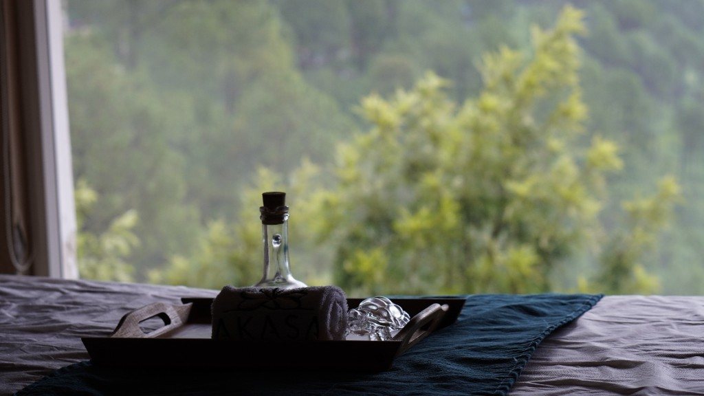 Quiet balcony moment with misty hillside views