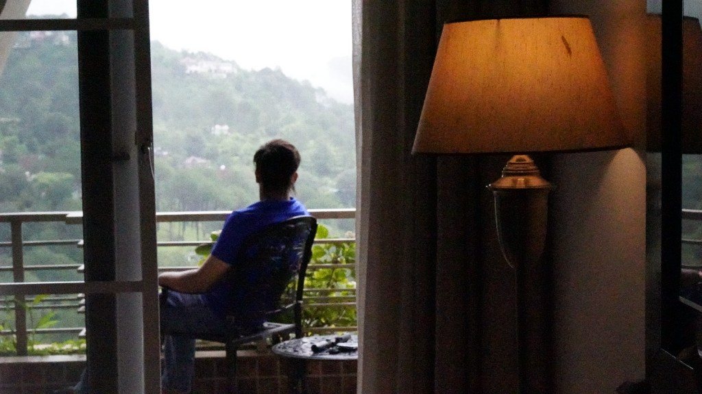Guest taking in the view from a private balcony