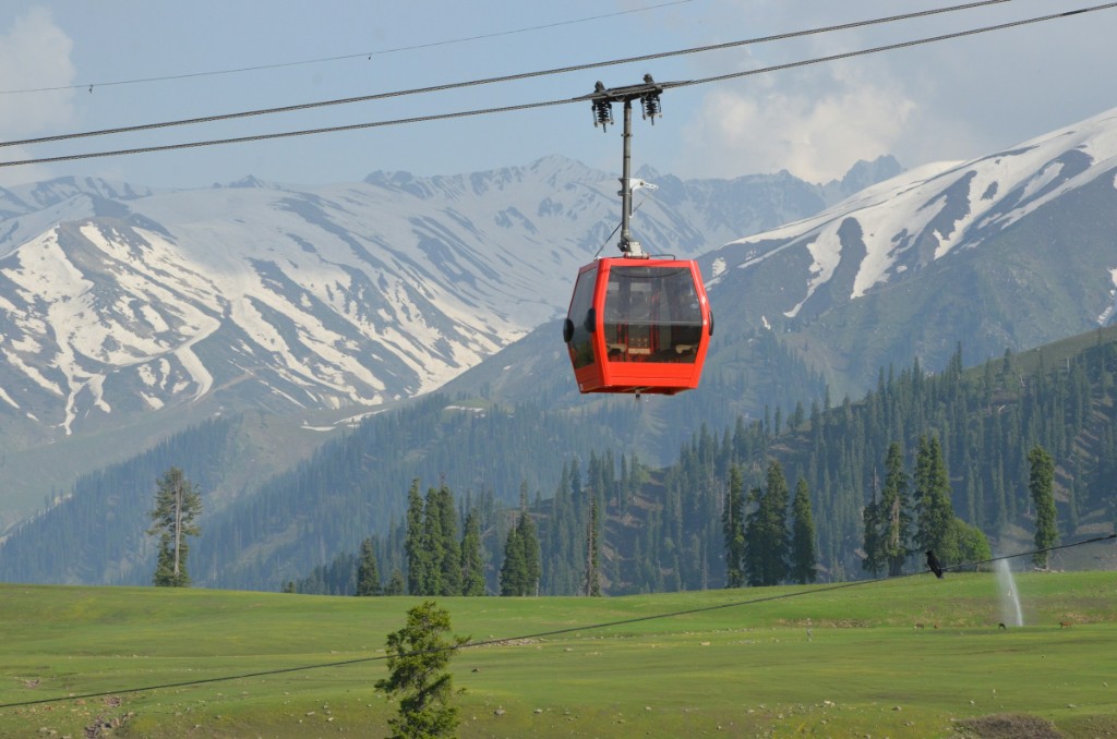 Gulmarg meadow with gondola cable car and snow peaks