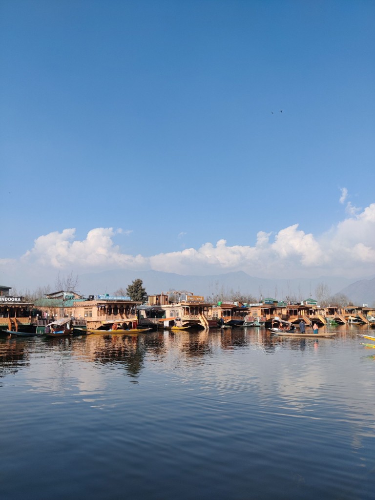 Houseboat check-in with welcome tray and Kashmiri tea on deck